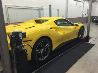 Yellow Ferrari being worked on at Sunbusters